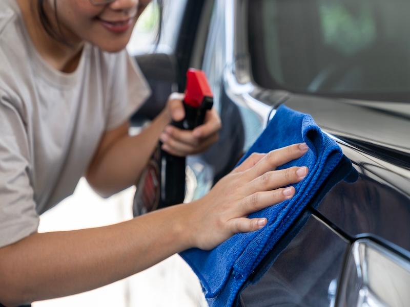 Woman Cleaning Car